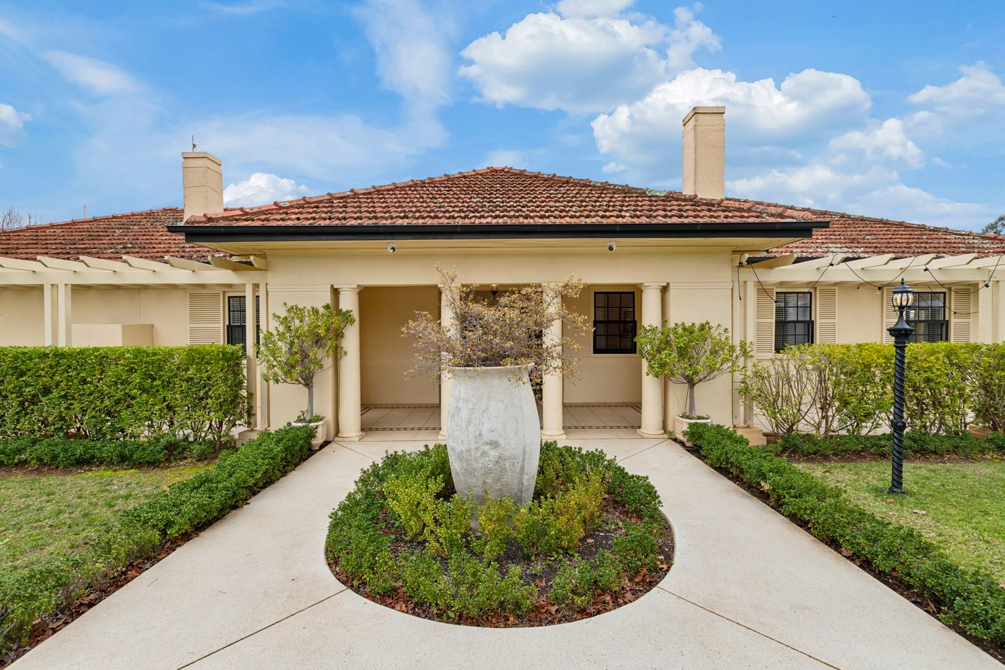 The columned front porch and formal garden approach to Villa Sol