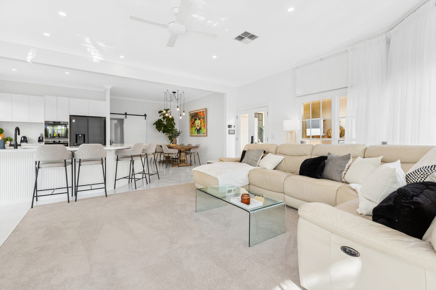 Open kitchen, dining and sunroom living spaces at Villa Sol